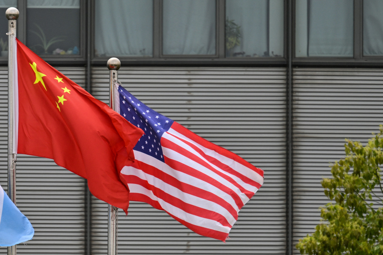 Chinese and U.S. flags flutter in the wind at the Boeing Shanghai Aviation Services facilities near the Shanghai Pudong International Airport in Shanghai on April 17, 2025. | Hector Retamal/AFP via Getty Images