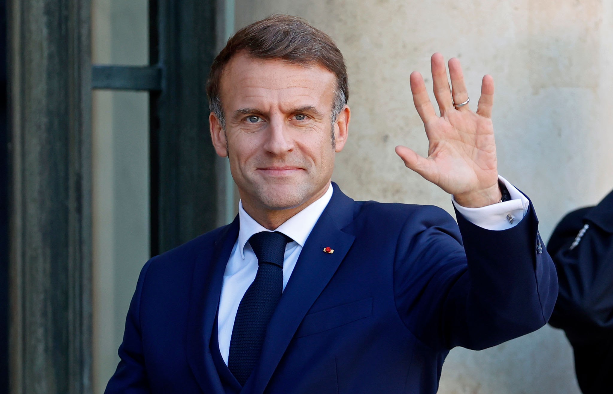PARIS, FRANCE - OCTOBER 23: French President Emmanuel Macron waves to media as he waits for Lebanese Prime Minister Najib Mikati prior to their meeting at Elysee Palace on October 23, 2024 in Paris, France. The meeting came ahead of the International Conference in Support of the Population and Sovereignty of Lebanon, which will be held tomorrow in Paris. (Photo by Chesnot/Getty Images)